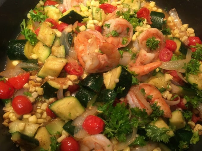 Shrimp stir fry with prawns, zucchini, corn and grape tomatoes for two close up