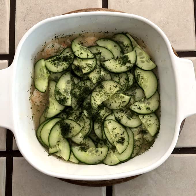 Fresh baked Parisian Shrimp and Cucumbers with Dill in a casserole dish.
