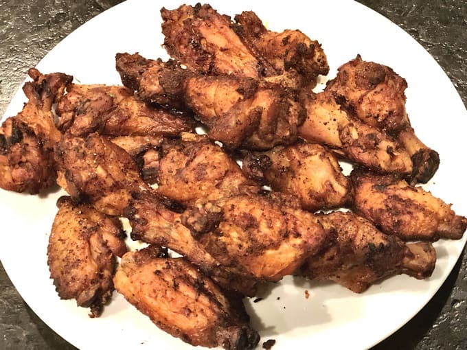 Instant Pot Pressure Cooker Chicken Wings on a white serving plate.