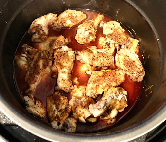 Cooking chicken wings in electric Instant Pot Pressure Cooker.