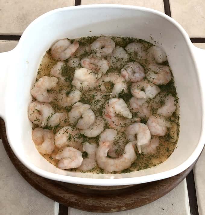 Casserole dish with shrimp, dry white wine, dill and cayenne.