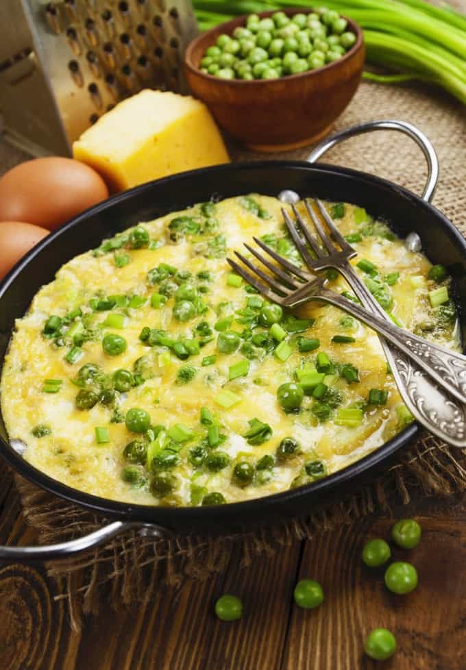 Spanish tortilla with green peas, potatoes and cheese