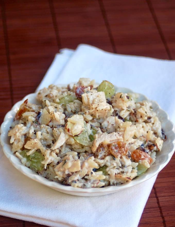 Chicken Wild Rice Salad with green grapes and almonds in white bowl