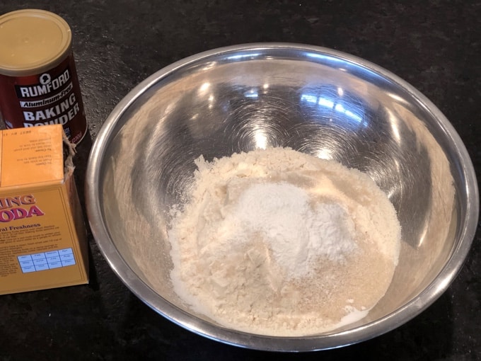 Flour, sugar, baking powder, baking soda and salt in mixing bowl.