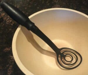 Potato Masher from The Pampered Chef in empty white bowl