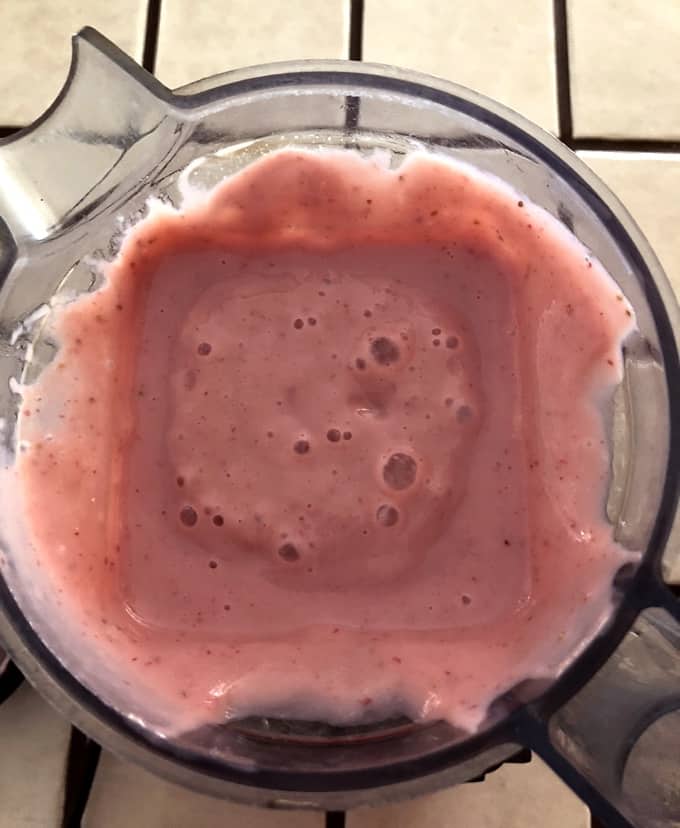 Blended strawberries, silken tofu and thickened apple juice mixture for making strawberry mousse.