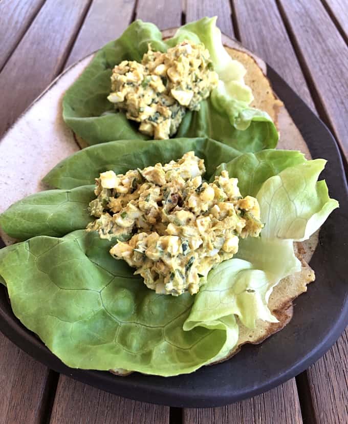 Curried egg salad sandwich wraps on Butter lettuce leaves.