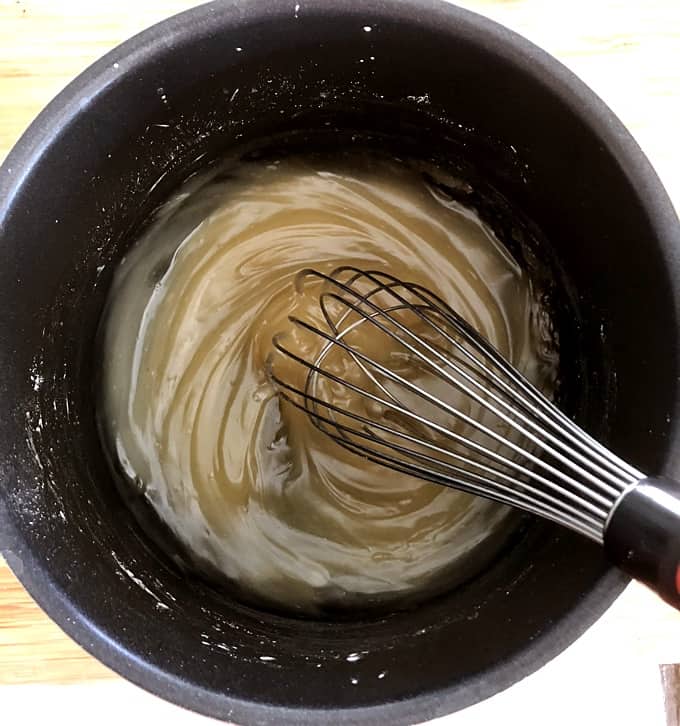 Whisking thickened apple juice, agave nectar, cornstarch and sea salt in saucepan.