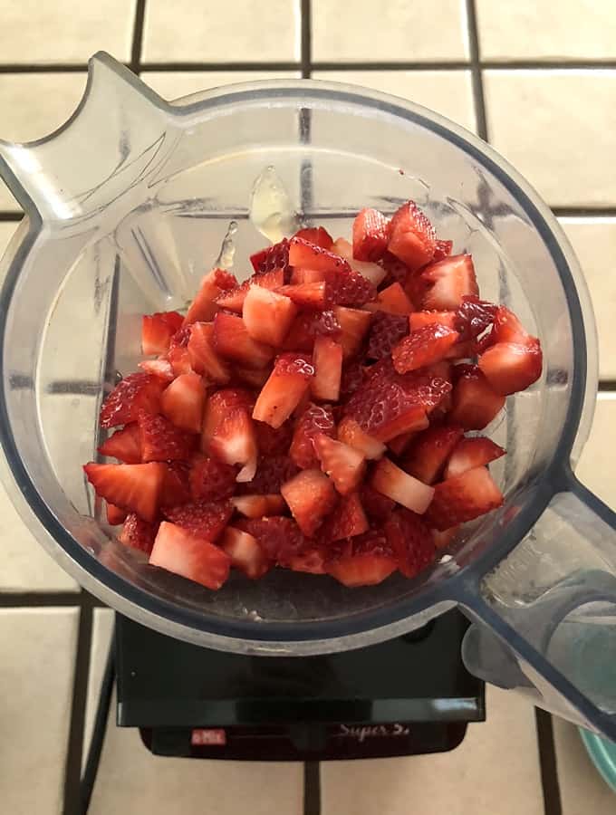 Chopped strawberries, silken tofu and apple juice mixture in blender.