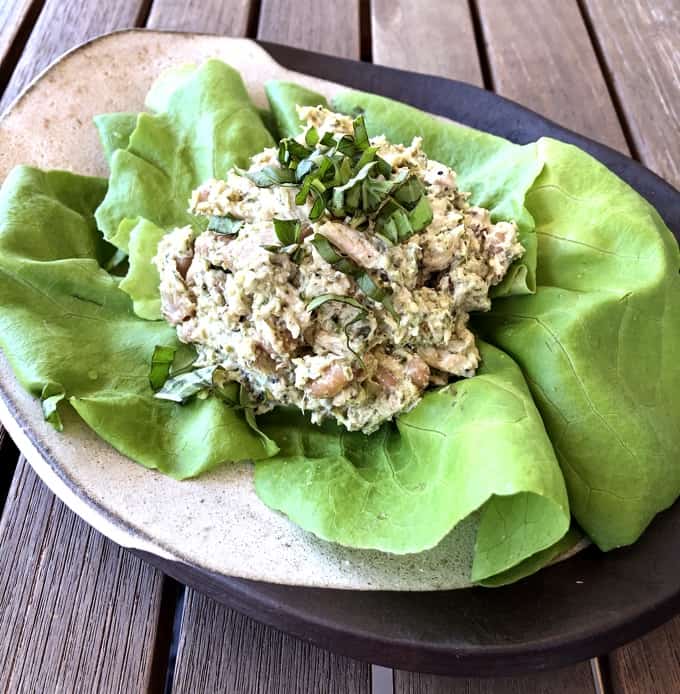 Tuna white bean salad lettuce wrap with butter lettuce leaf on ceramic potter plate.