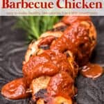 Baked BBQ Chicken smothered with extra barbecue sauce on decorative black plate.