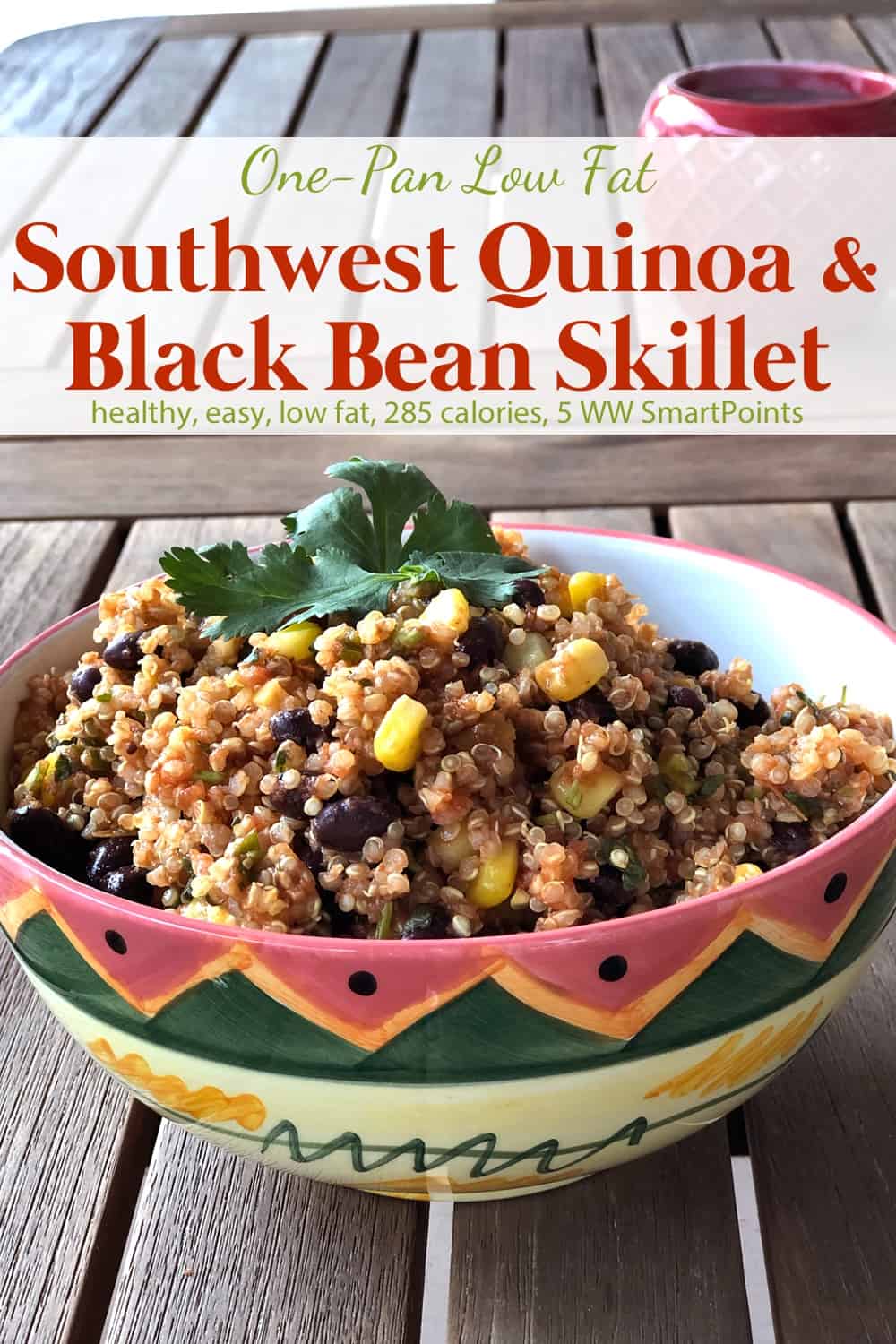 Southwest quinoa with black beans and corn in pretty ceramic bowl garnished with fresh cilantro.