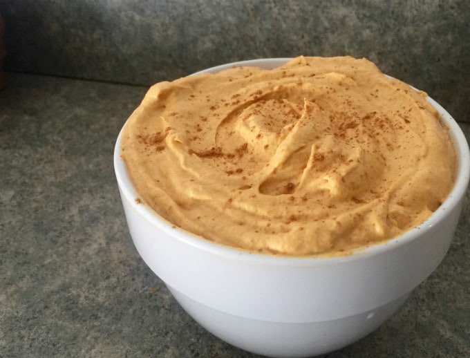 WW Pumpkin Mousse Fluff sprinkled with cinnamon in small white bowl.
