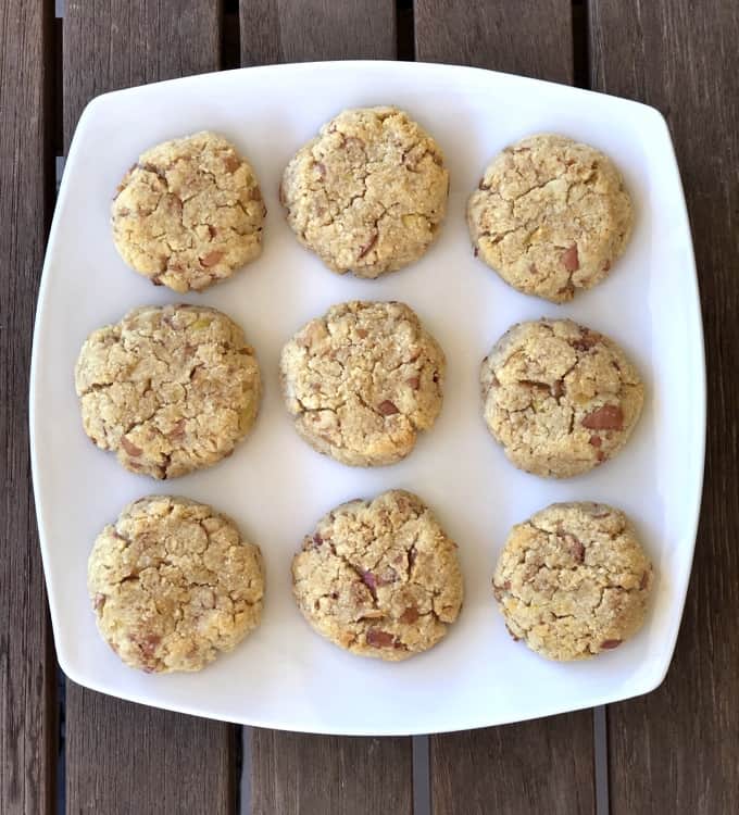 Almond apple cookies on square white plate from above.