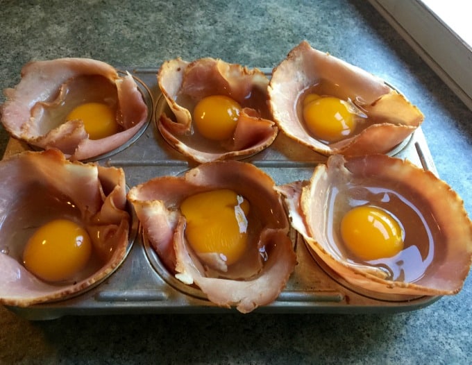 6-cup muffin tray filled with ham and egg