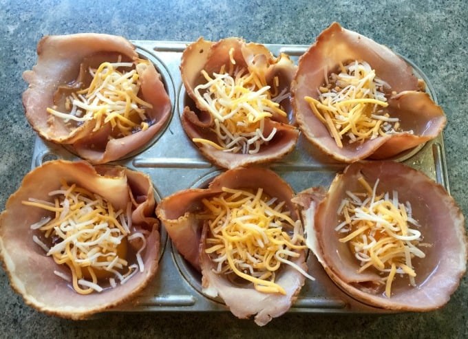 6-cup muffin tin filled with ham, egg and cheese