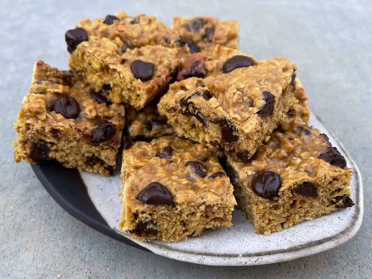 Low Fat Oatmeal Chocolate Chip Squares stacked on ceramic plate.