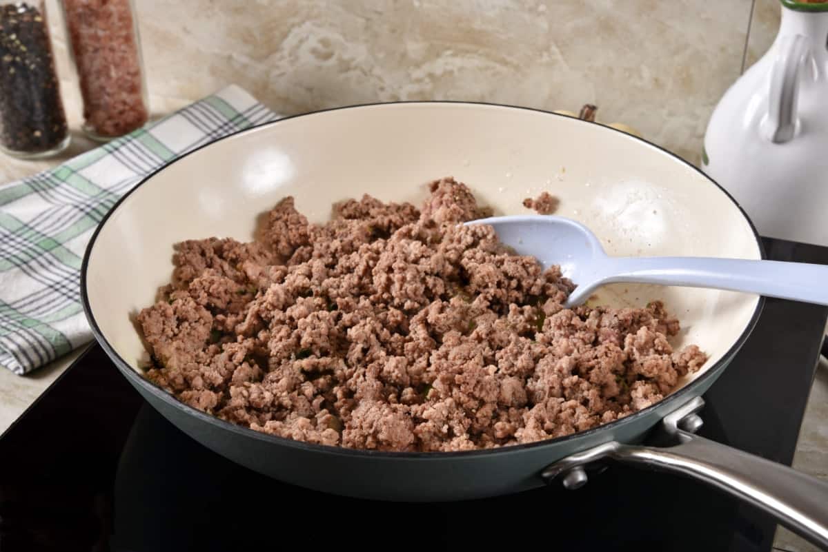 Lean ground beef in a saute pan.