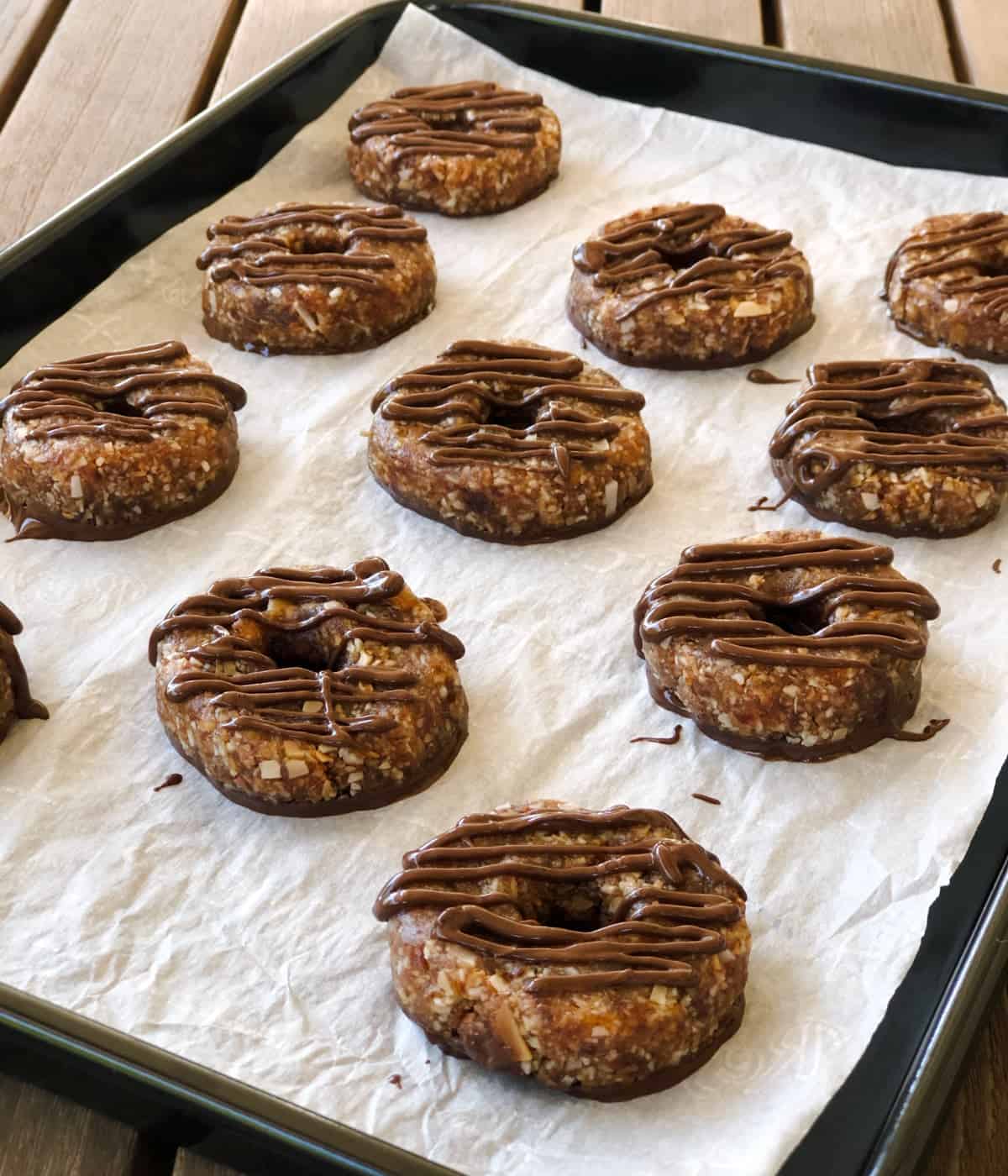 No-bake Samoas cookies on parchment lined baking pan.