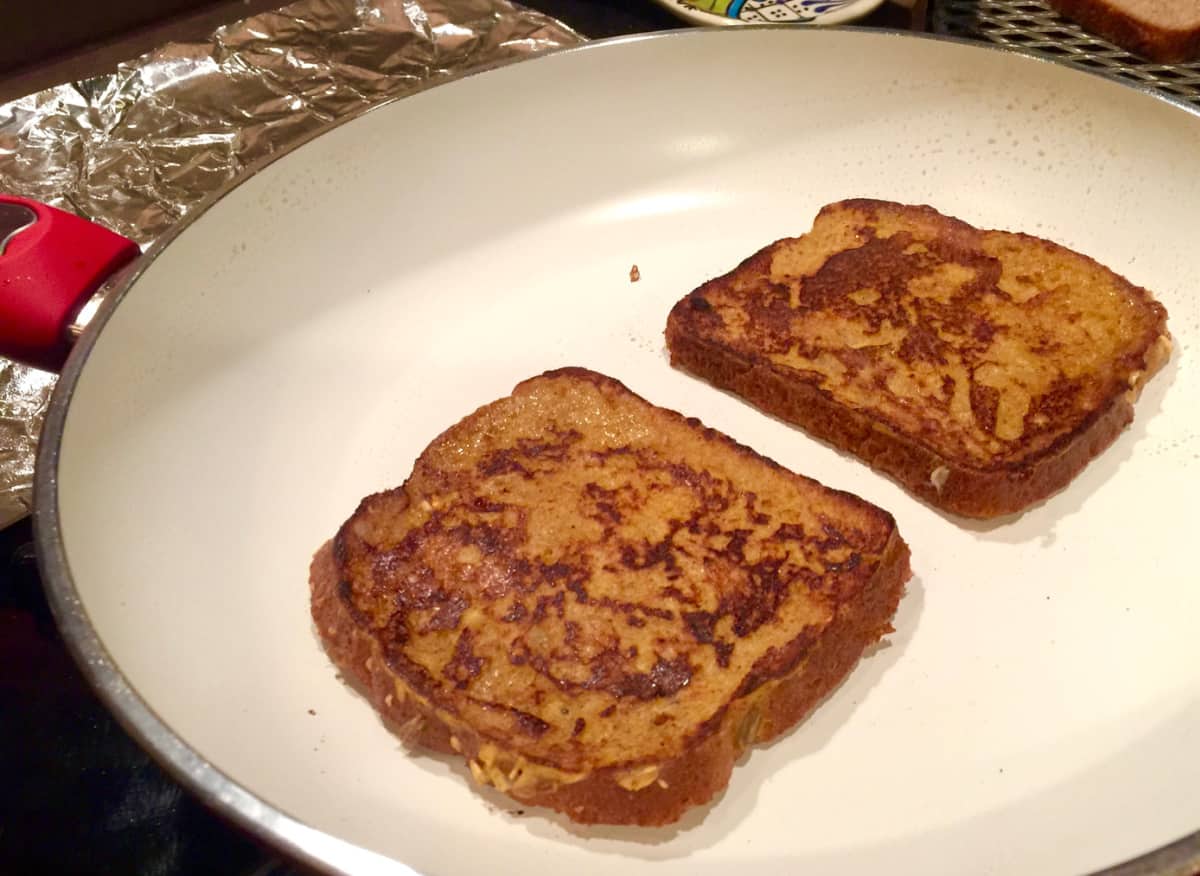 Cooking french toast in skillet.