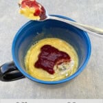 blue mug with easy microwave cottage cheese topped with raspberry jam with Text Box Overlay for Pinterest PIN