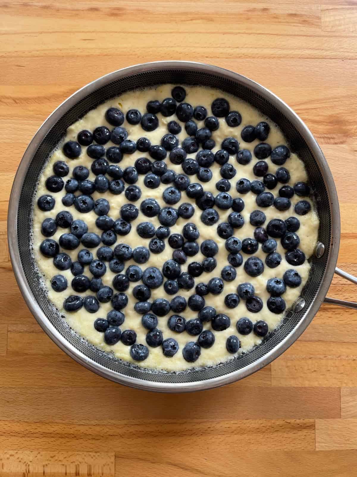 Uncooked blueberry skillet pancake.