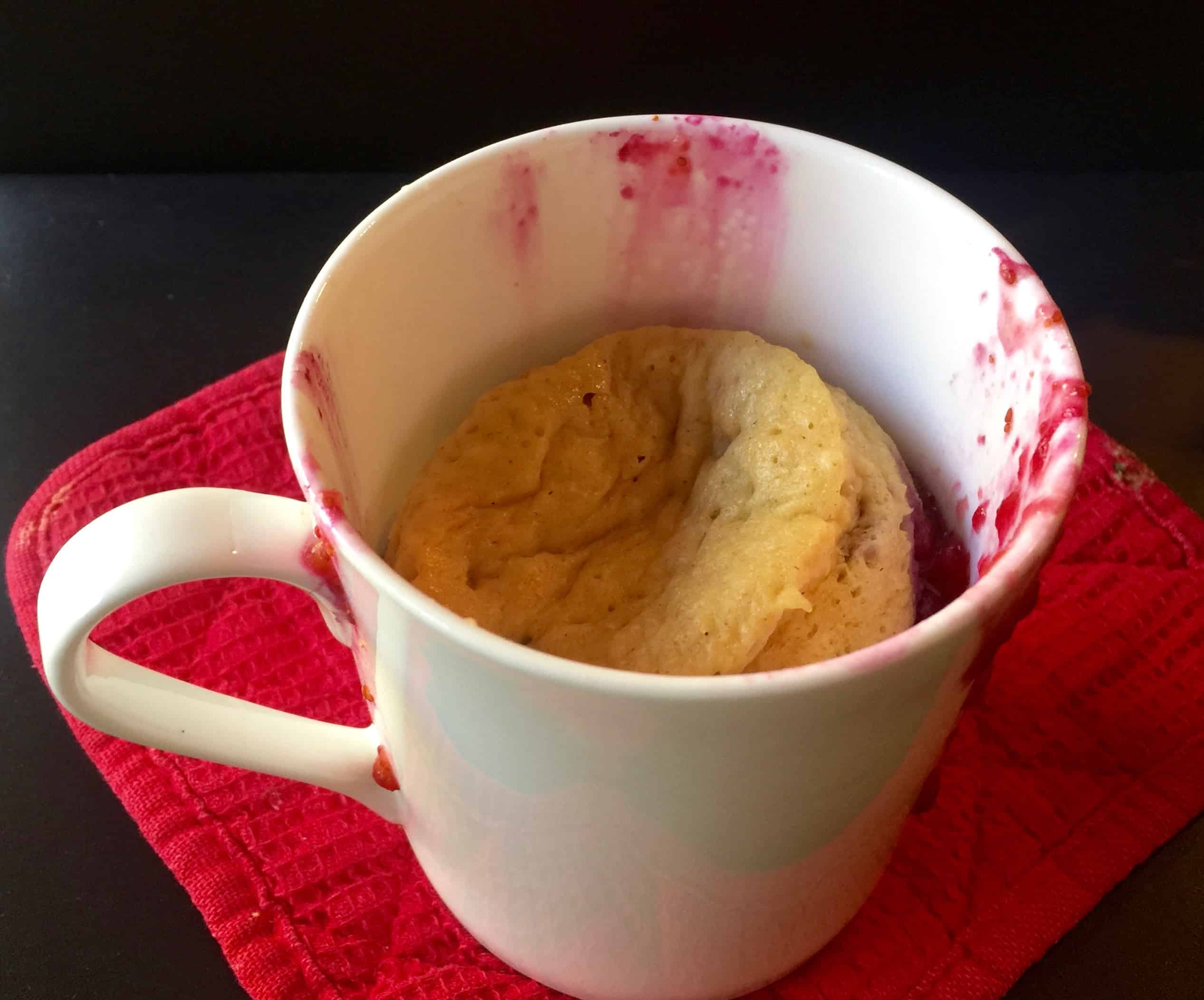 Microwave pancake mug with fresh berries.
