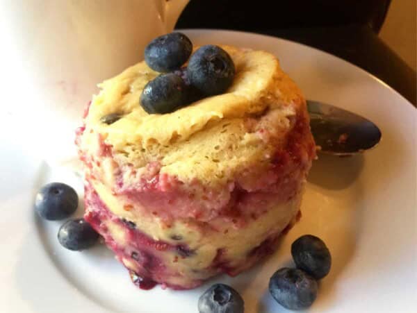 Microwave Mug Kodiak Protein Pancake on White Plate with White Mug in Background