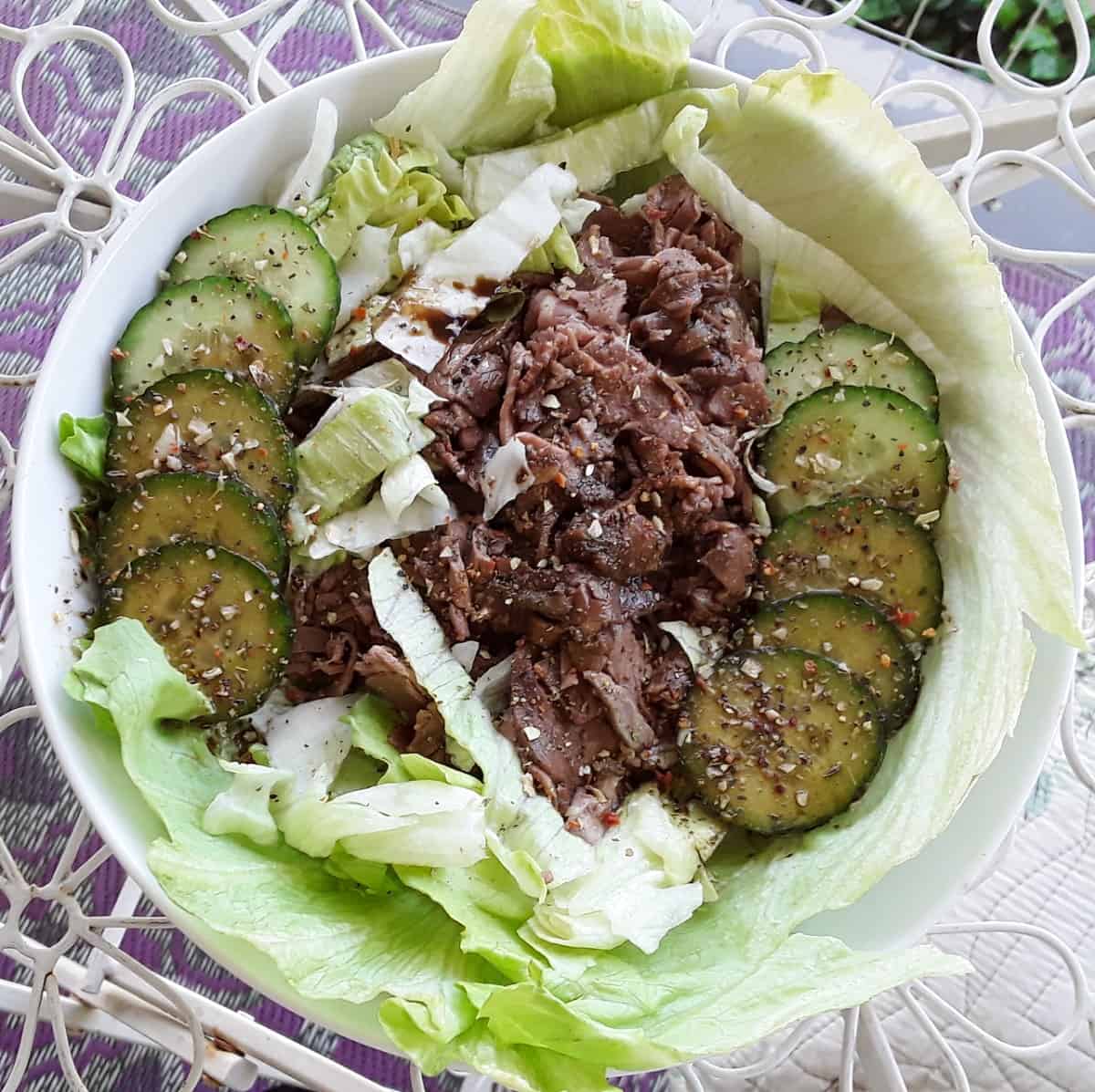 Thai beef salad with fresh cucumbers from above.