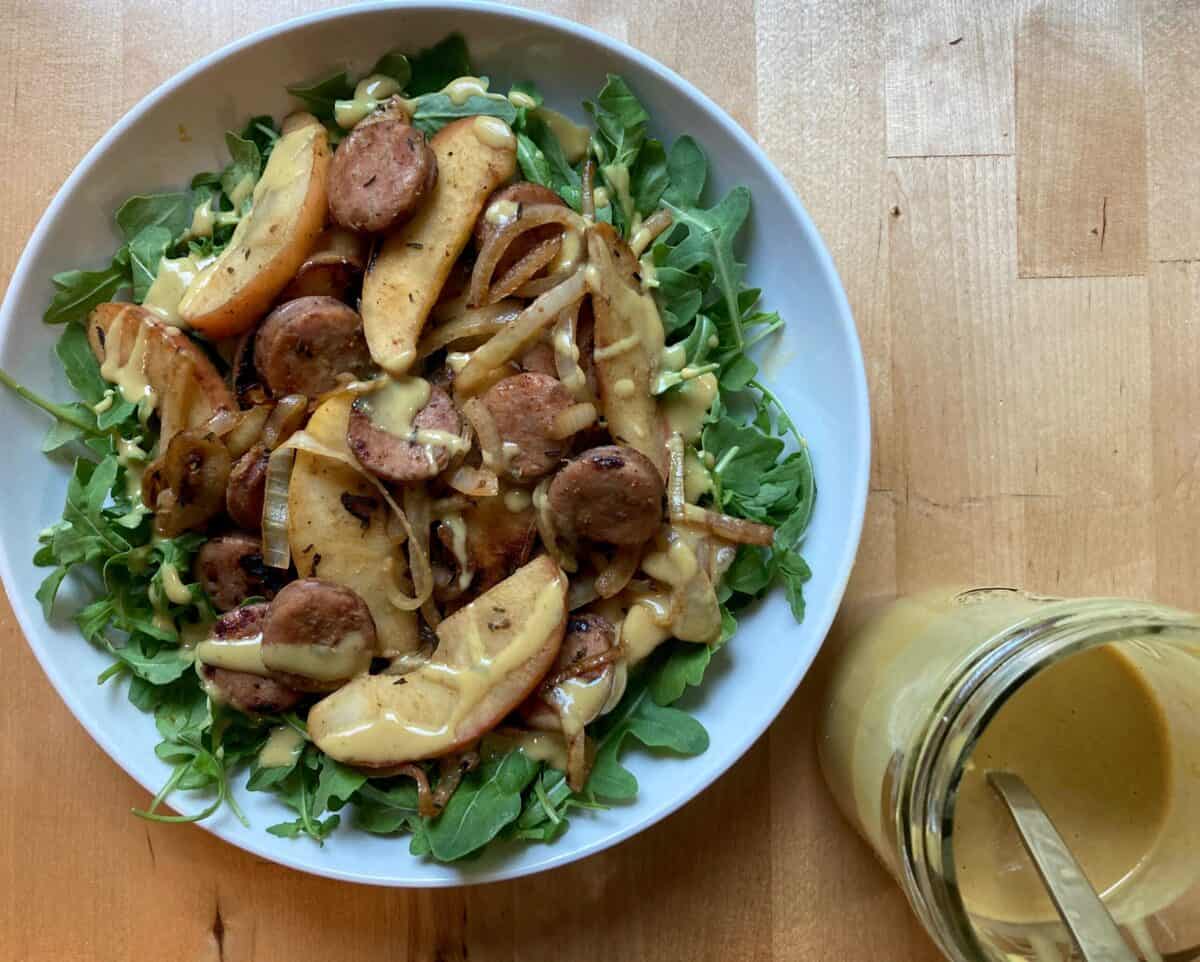 Cooked chicken sausage, apples and onions on bed of arugula drizzled with honey mustard.