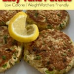 4 tuna patties on a white plate garnished with a lemon slice
