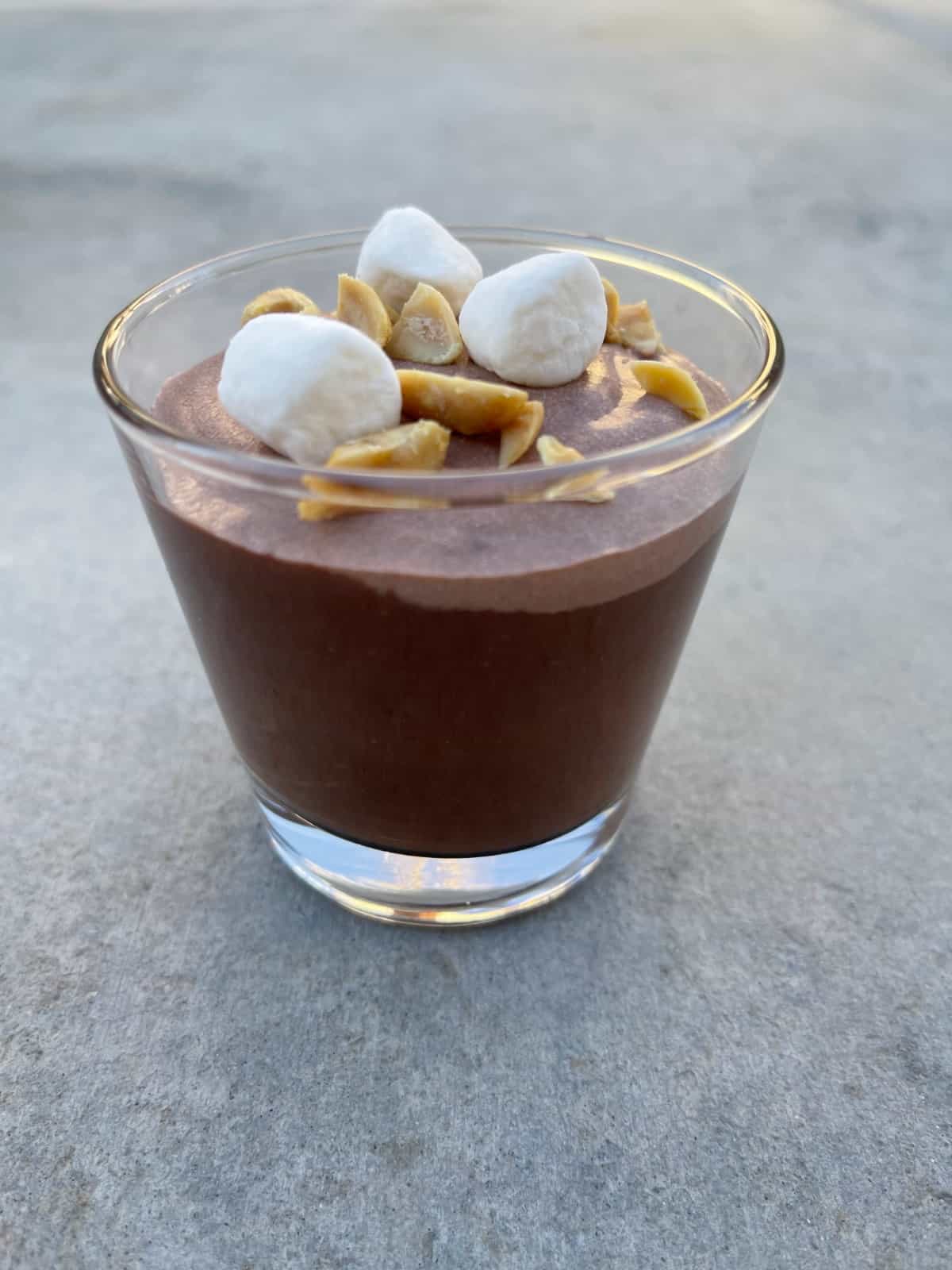 Rocky Road Pudding Parfait topped with mini marshmallows and chopped peanuts.