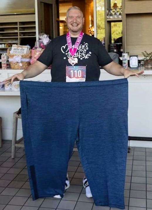 Jim H. holding up XXXL pants he used to wear.