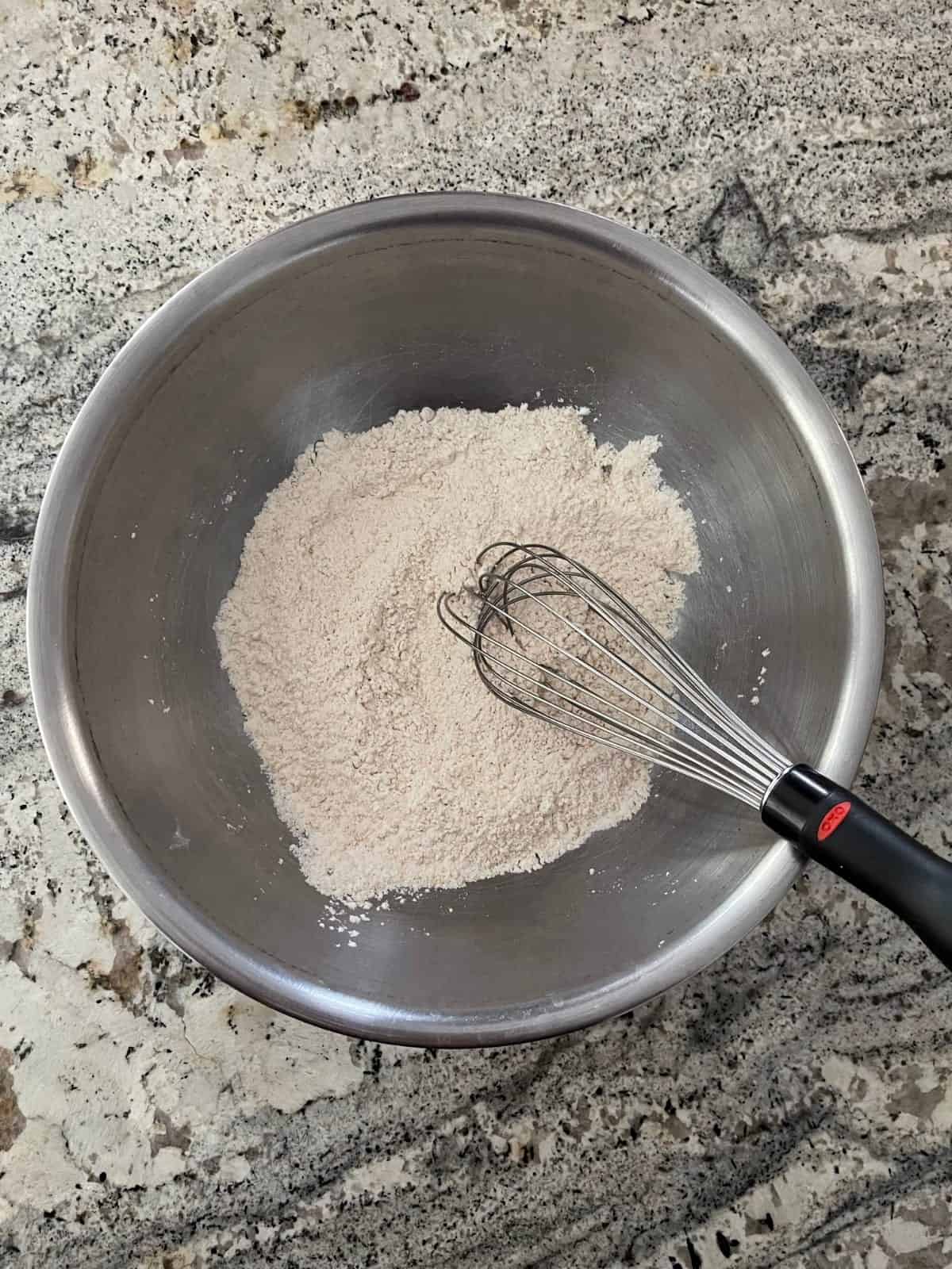 Whisking flour, baking powder, salt, cinnamon and Truvia Brown Sugar Blend in mixing bowl.