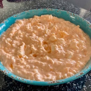 easy orange delight salad in turquoise serving dish close up