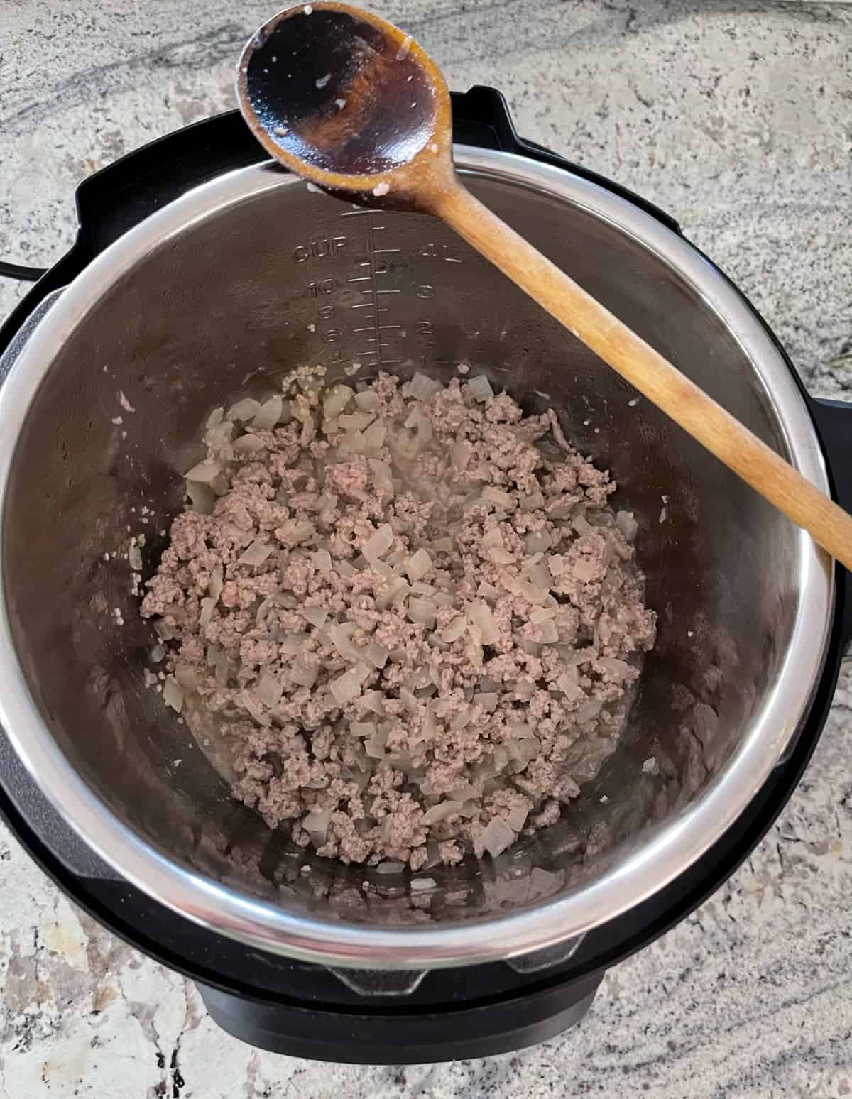 Sauteeing onions, garlic and ground turkey in instant pot.