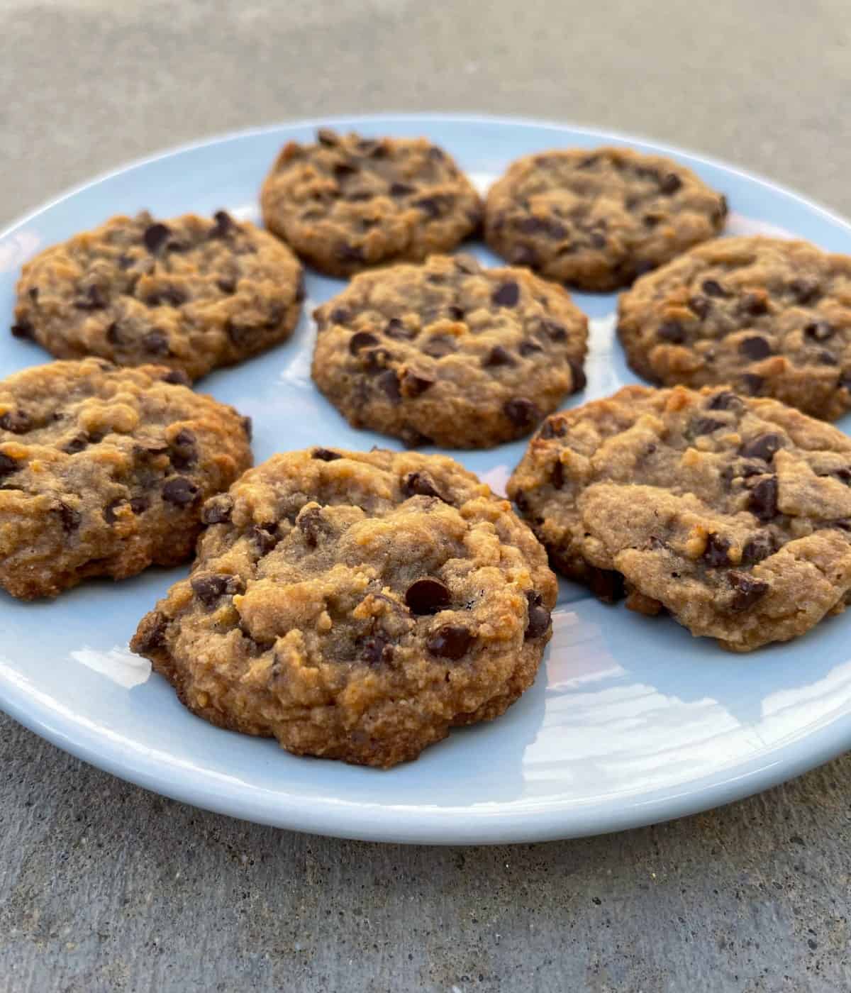 Tablespoon chocolate chip cookies on round plate.