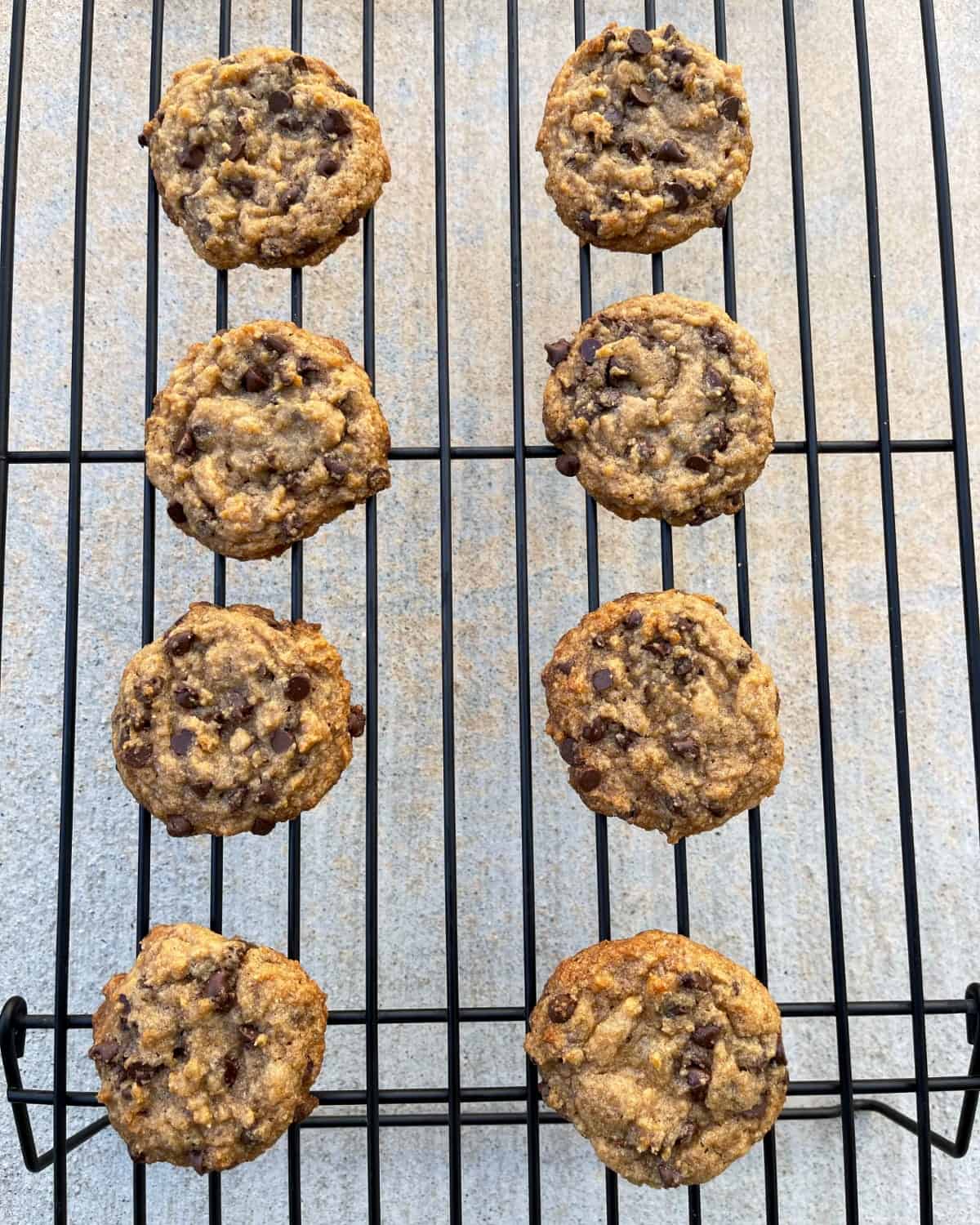 Tablespoon chocolate chip cookies cooling on wire rack.