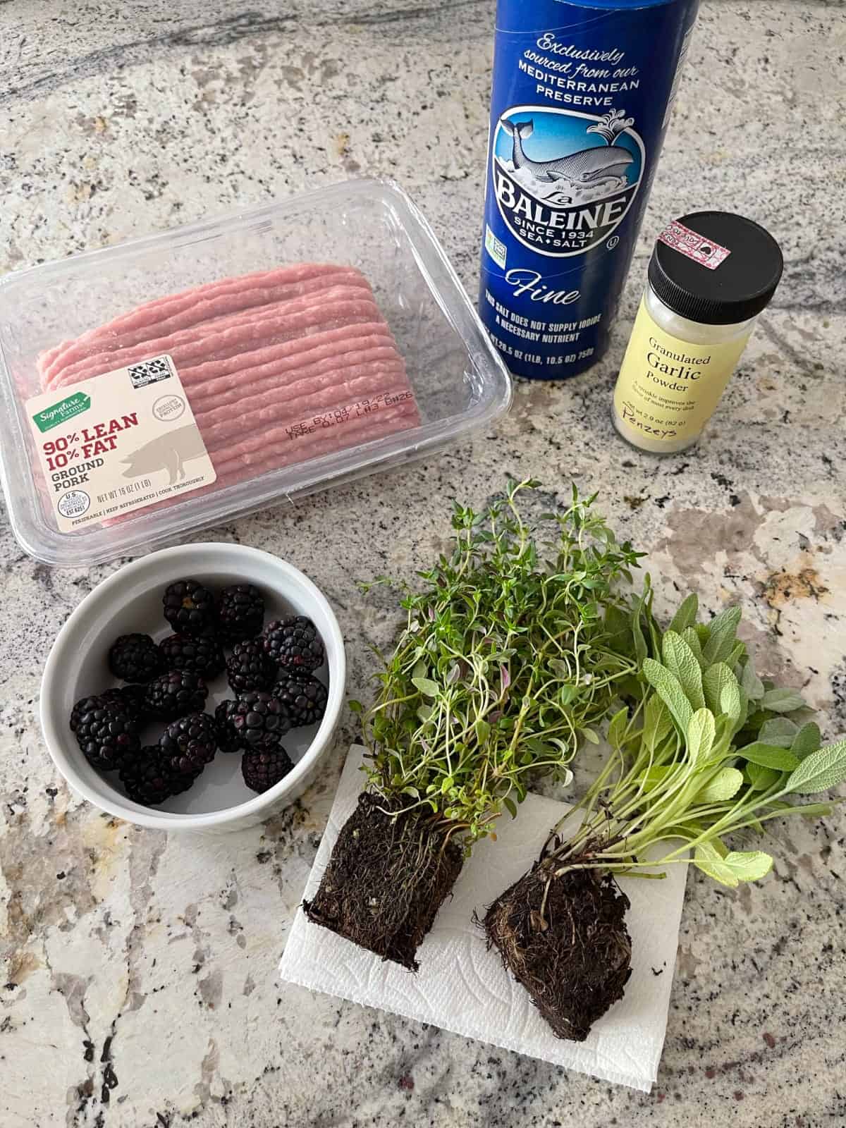 Ingredients including ground pork, blackberries, sage, thyme, garlic powder and sea salt.