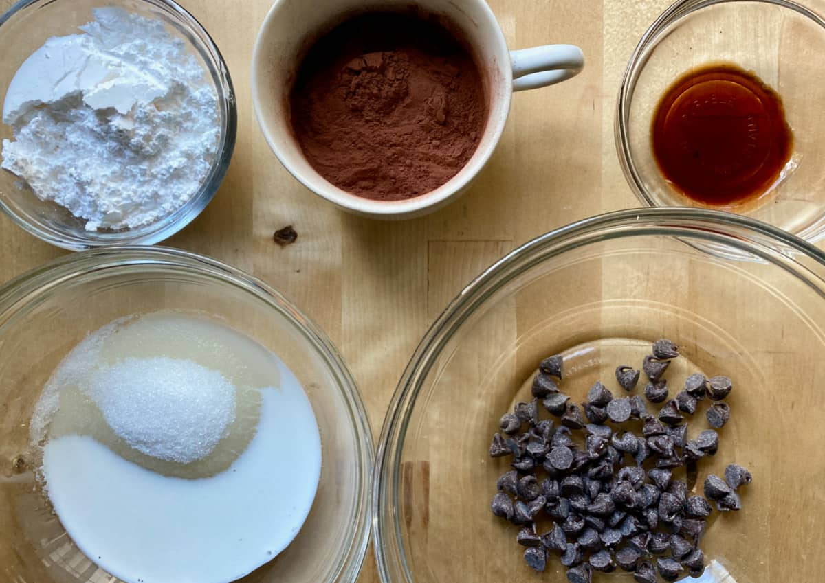 Ingredients including cocoa powder, vanilla, chocolate chips, powdered sugar and monkfruit sweetener.