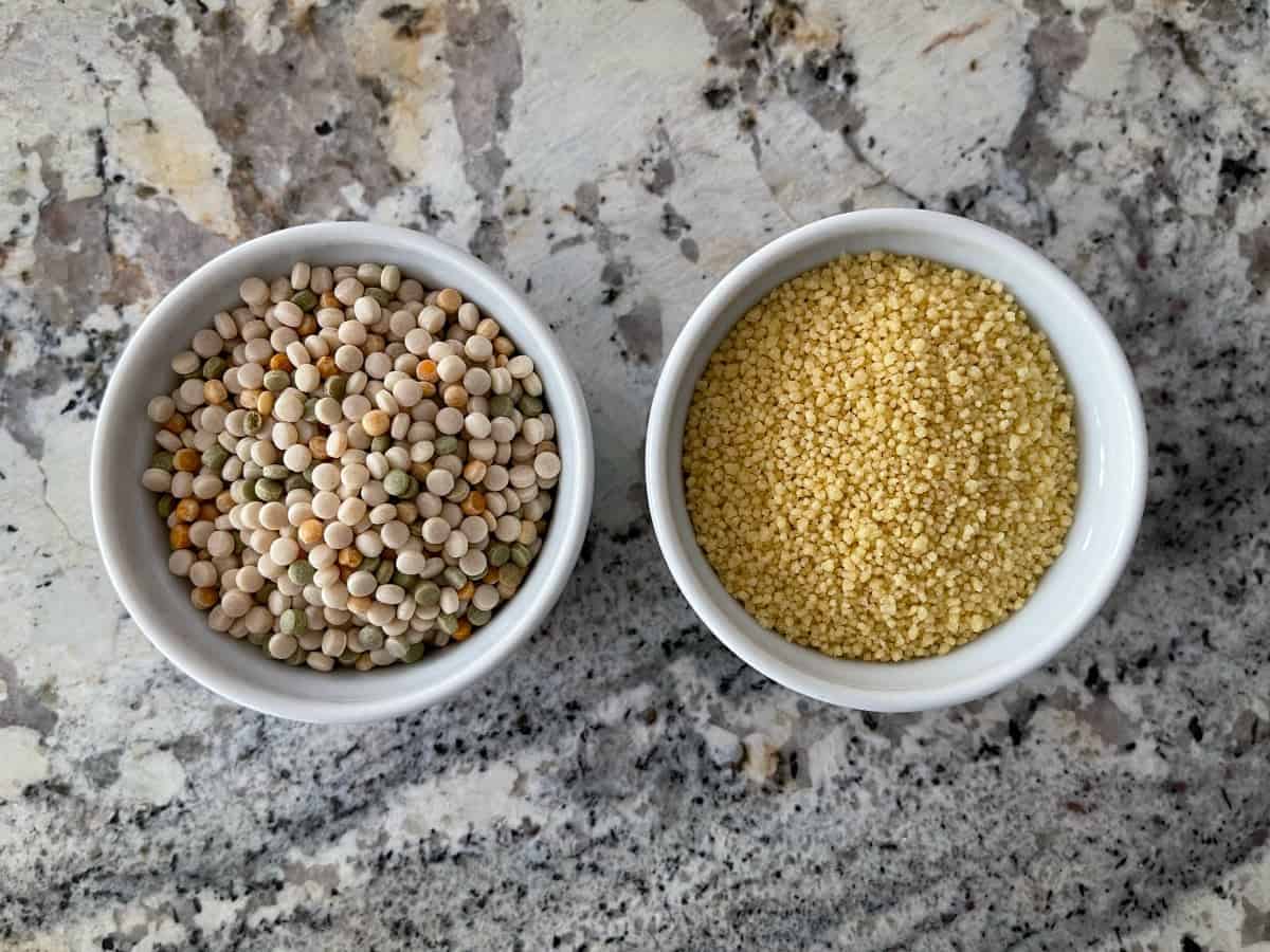 Two small white ramekins, one with Israeli couscous and the other with regular couscous.