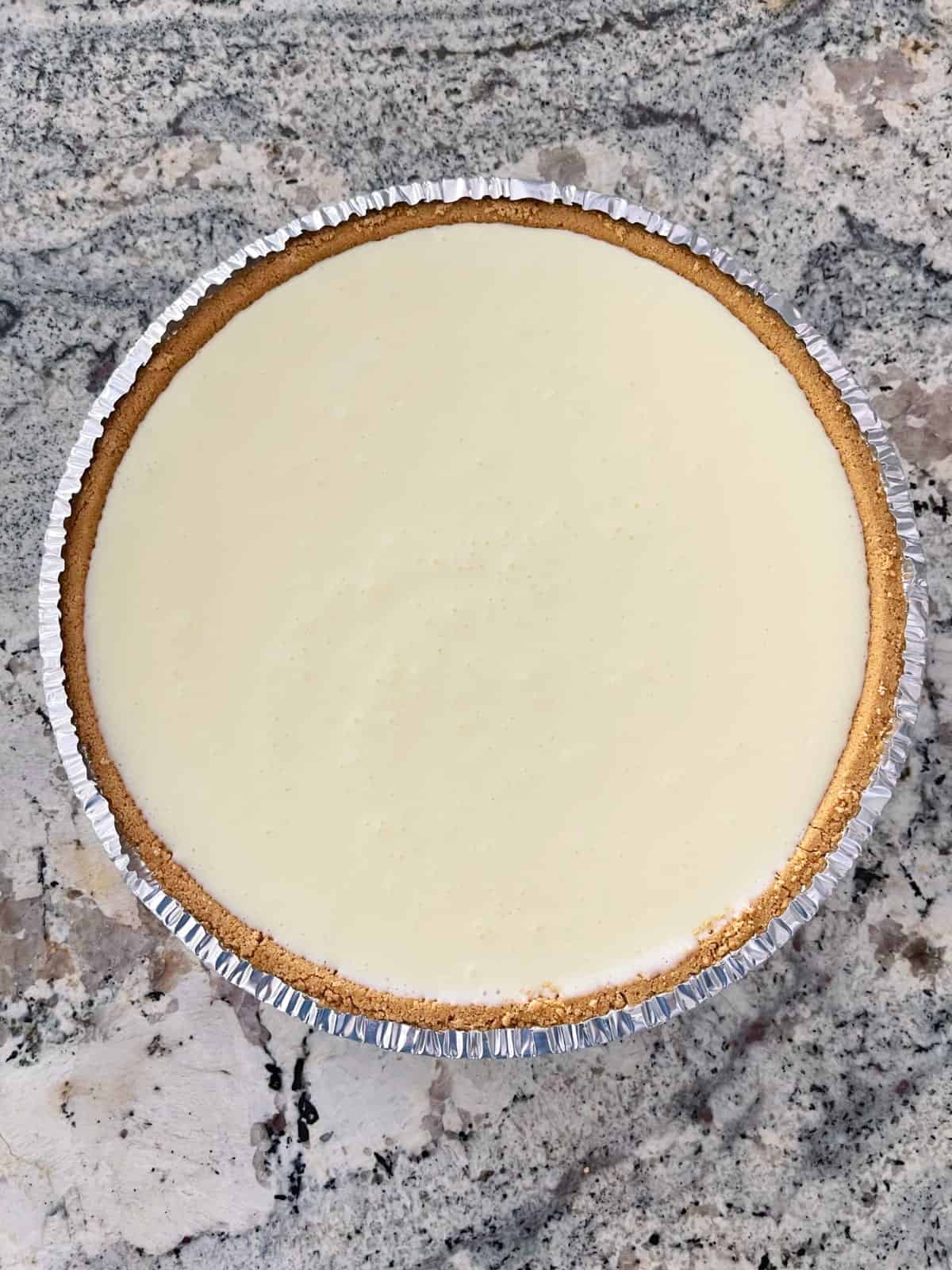 Lemon Jello yogurt pie in graham cracker crust.