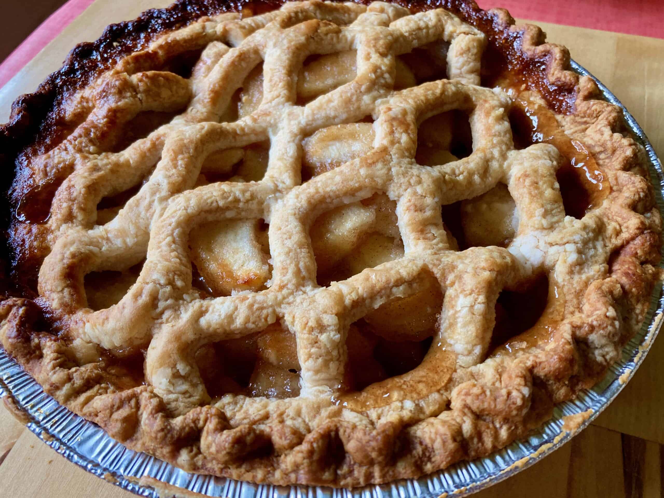 Fresh baked homemade apple pie with lattice crust.
