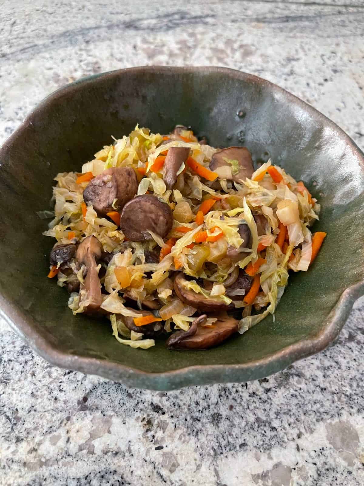 Instant pot vegetarian egg roll bowl in green ceramic bowl without sesame seeds.