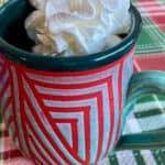red and green mug with whipped cream and text: low calorie peppermint mocha