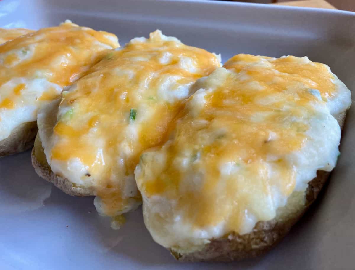 Healthy twice baked potatoes with green onions and cheddar cheese.