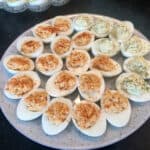Round Platter of Deviled Eggs Garnished with Parsley and Dill