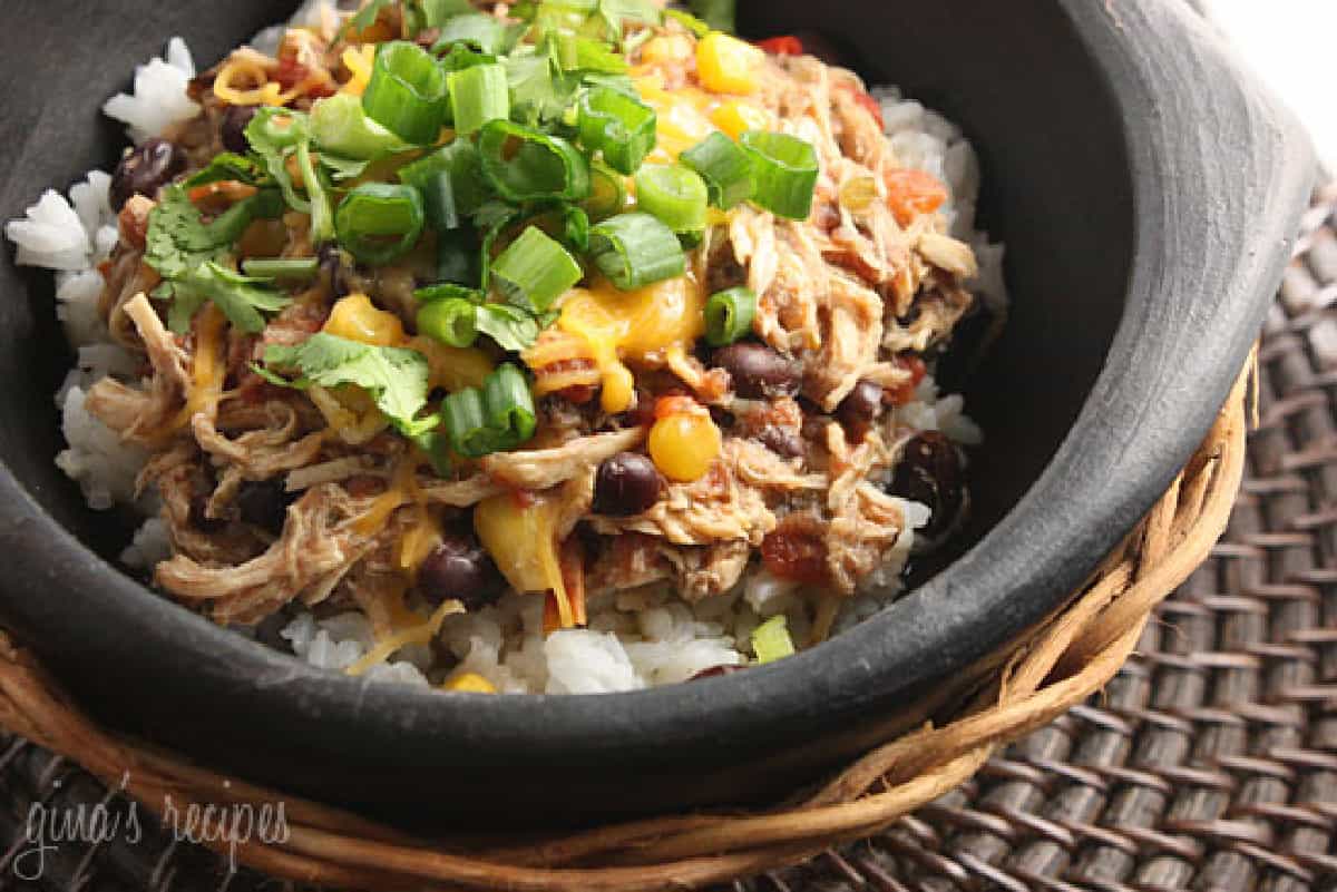 Brown Pottery Dish with Shredded Santa Fe Chicken garnished with scallions