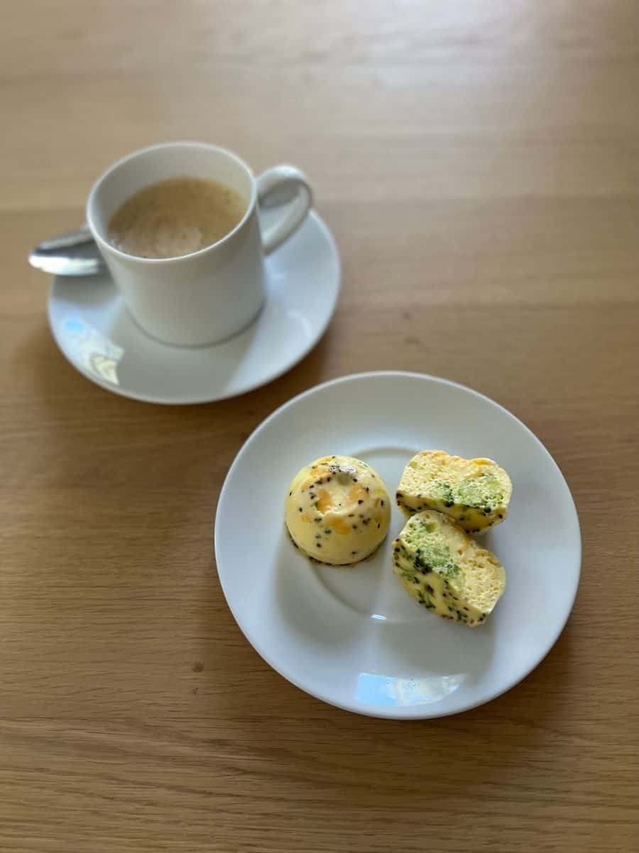 WW Instant Pot Egg Bites on White Plate with Cup of Coffee Beside.