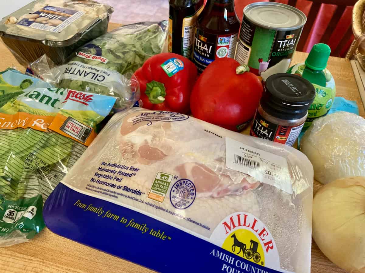 Chicken breasts, jar of red curry paste, red bell peppers, chicken broth, light coconut milk, lime, snow peas, mushrooms, salt pepper